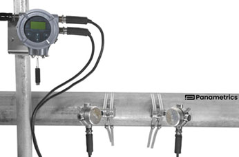 PanaFlow LC Clamp-on Liquid Flow Meter (XMT1000) and its transducers in junction boxes installed on a pipe